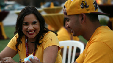 ASU mom and son sitting together on the grass